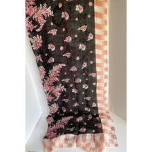 Load image into Gallery viewer, Floral patterned scarf with pink and white flowers on a black background, draped over a surface.