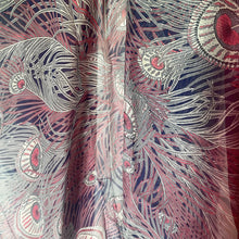 Load image into Gallery viewer, Close-up of a fabric with intricate peacock feather pattern in red, white, and blue.