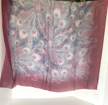 Load image into Gallery viewer, Silk scarf with peacock feather pattern on a white surface