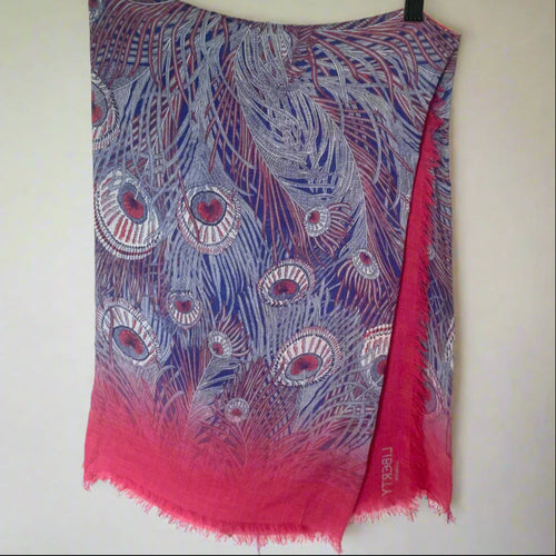 Scarf with peacock feather pattern in purple and pink on a white background
