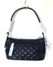 Load image into Gallery viewer, Black quilted handbag with tags on a white background