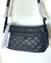 Load image into Gallery viewer, Black quilted handbag with visible brand name on a white background