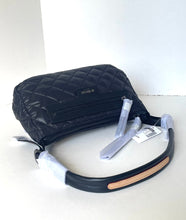 Load image into Gallery viewer, Black quilted bag with a strap on a white background