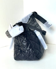 Load image into Gallery viewer, Black quilted bag with straps on a white background