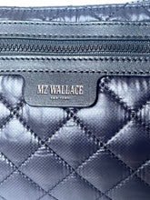 Load image into Gallery viewer, Quilted bag with MZ Wallace logo on a metallic blue background