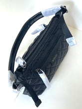 Load image into Gallery viewer, Black quilted bag with visible branding on a white background