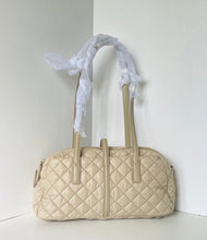 Load image into Gallery viewer, Beige quilted handbag with white lace on a white background