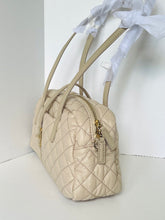 Load image into Gallery viewer, Beige quilted handbag on a white background