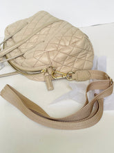 Load image into Gallery viewer, Beige quilted handbag with a strap on a white surface