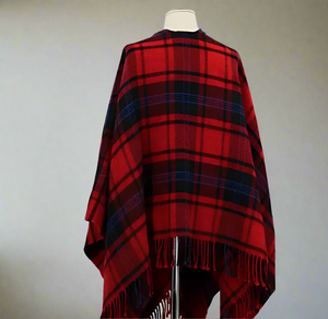 Red and black plaid poncho on a mannequin against a white background