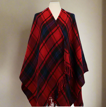 Load image into Gallery viewer, Red and black plaid poncho with fringes on a mannequin against a white background