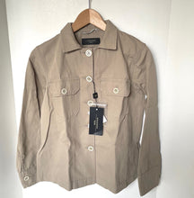 Load image into Gallery viewer, Beige jacket on a hanger with a visible brand tag against a white background