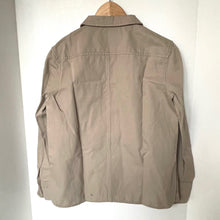 Load image into Gallery viewer, Beige jacket on a wooden hanger against a white wall