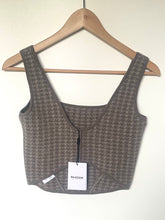 Load image into Gallery viewer, Gray textured crop top on a hanger with a visible brand tag against a white background