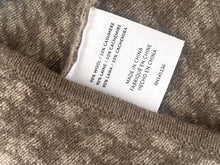 Load image into Gallery viewer, Fabric label on a textured fabric background