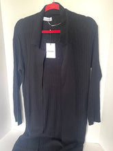 Load image into Gallery viewer, A black textured knit cardigan sweater with a wide collar, hanging on a red hanger with a white tag against a plain white background.