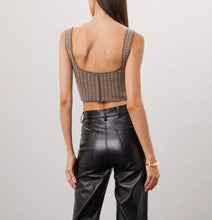 Load image into Gallery viewer, Person wearing a patterned crop top and black leather pants on a plain background