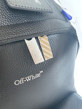Load image into Gallery viewer, Black leather bag with 'Off-White' logo and tag on a white background