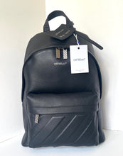 Load image into Gallery viewer, Black backpack with 'Off-White' tag on a white background