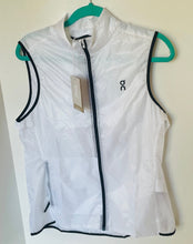 Load image into Gallery viewer, White sports vest with black accents on a hanger against a white background