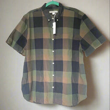 Load image into Gallery viewer, Plaid shirt on a hanger against a white background