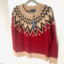 Load image into Gallery viewer, Red and beige patterned sweater with a brand tag on a white background
