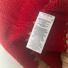 Load image into Gallery viewer, Red knitted fabric with a label on a white background