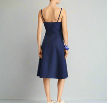 Load image into Gallery viewer, Navy blue dress worn by a model on a white background