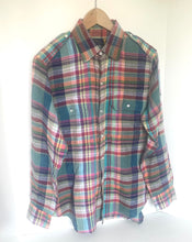 Load image into Gallery viewer, Multicolored plaid shirt on a hanger against a white background
