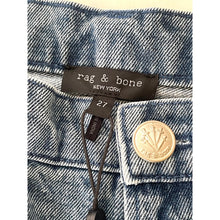 Load image into Gallery viewer, Close-up of a denim jacket with 'rag &amp; bone' label and button detail.