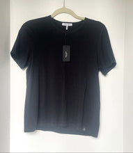 Load image into Gallery viewer, Black t-shirt on a hanger with a white background