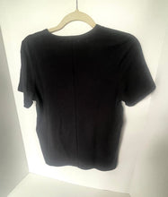 Load image into Gallery viewer, Black t-shirt on a hanger against a white background