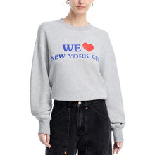 Load image into Gallery viewer, Person wearing a gray sweatshirt with 'WE ♥ NEW YORK CITY' text on a white background