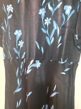 Load image into Gallery viewer, A close-up of a dark brown or black satin-like fabric with a light blue floral and leaf pattern.