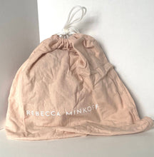 Load image into Gallery viewer, Pink drawstring bag with 'Rebecca Minkoff' branding on a white background