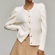 Load image into Gallery viewer, White cardigan worn by a person on a gray background