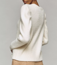 Load image into Gallery viewer, White fluffy sweater worn by a person on a gray background