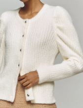 Load image into Gallery viewer, Close-up of a person wearing a white knitted cardigan against a neutral background