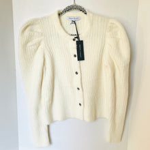 Load image into Gallery viewer, Cream-colored cardigan on a hanger with a visible brand tag against a white background
