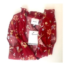 Load image into Gallery viewer, Red floral dress with 'Reformation' tag on a white background