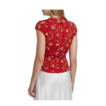 Load image into Gallery viewer, Red floral blouse worn by a person on a white background