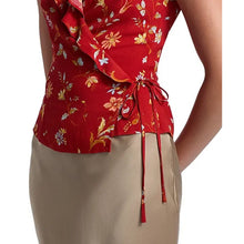 Load image into Gallery viewer, Red floral top with a tie waist worn by a person on a white background