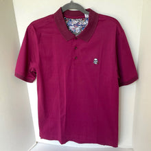 Load image into Gallery viewer, Maroon polo shirt with a small logo on a white background