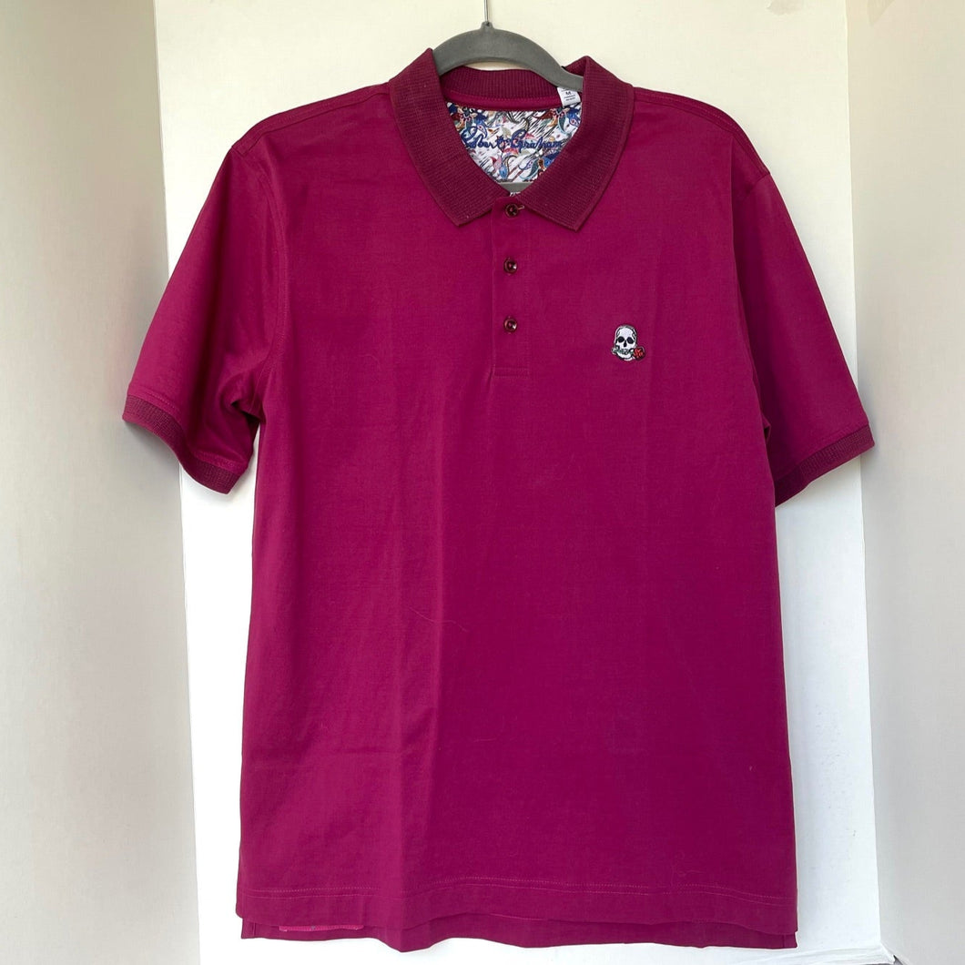 Purple polo shirt with a small logo on a white background