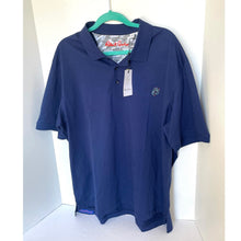 Load image into Gallery viewer, Blue polo shirt on a hanger with a visible brand logo against a white background