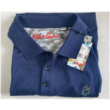 Load image into Gallery viewer, Folded blue polo shirt with a tag on a textured surface