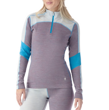 Load image into Gallery viewer, Woman wearing a purple and blue athletic top on a white background