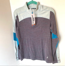 Load image into Gallery viewer, Gray and white pullover with blue accents on a hanger against a white background