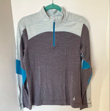 Load image into Gallery viewer, Gray and blue pullover with a quarter zip on a hanger against a white background