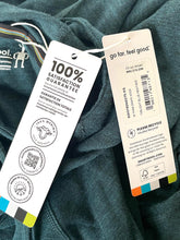 Load image into Gallery viewer, Close-up of dark teal-green fabric with two hanging tags attached. One white tag reads '100% SATISFACTION GUARANTEE' with certification icons, and the other shows 'go far, feel good.